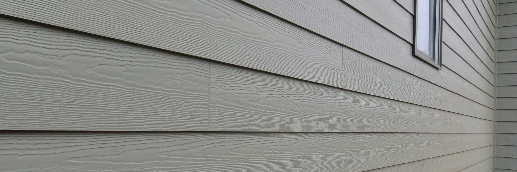 Close-up of gray fiber cement lap siding